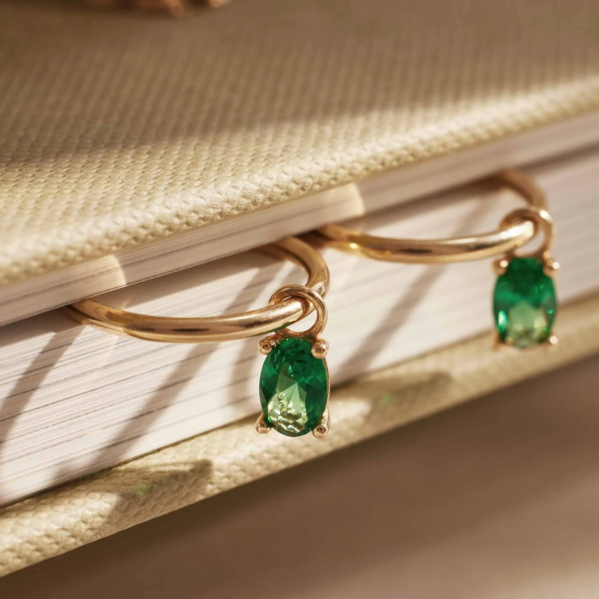 Baguette Olivia 14 karat gold hoop earrings with green zirconia stone