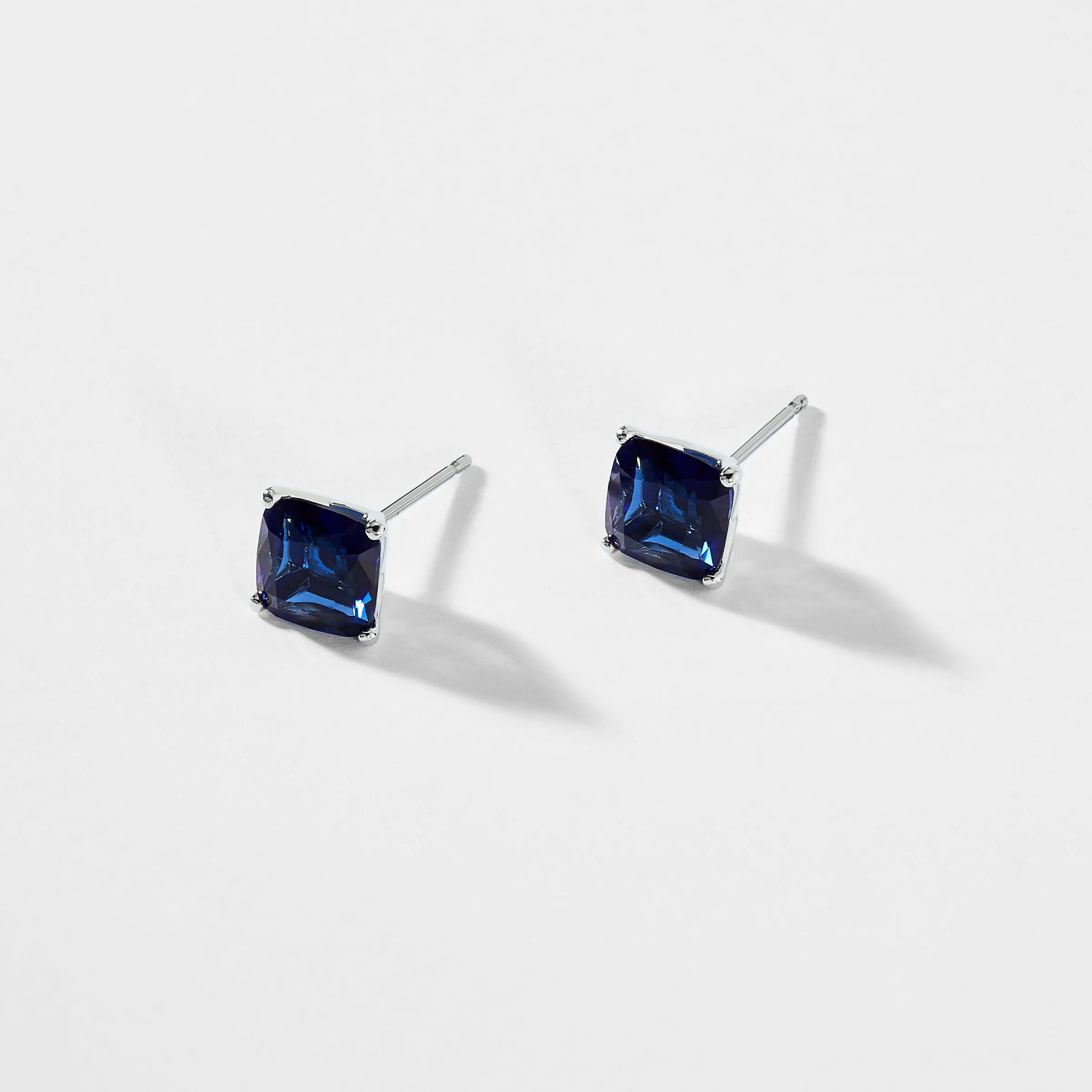 MODERN LOVE LARGE CUSHION CUT FAUX SAPPHIRE STUD EARRINGS