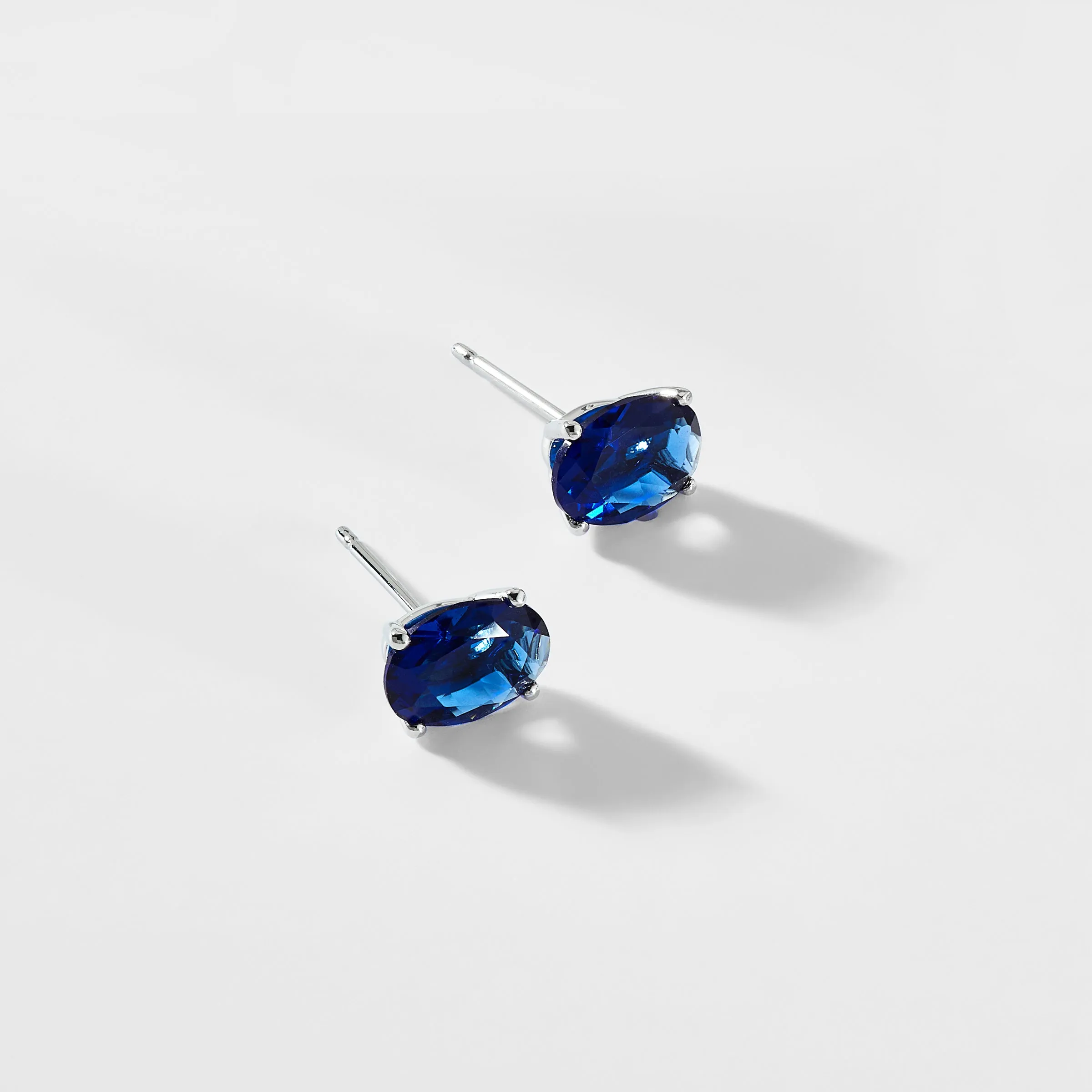 MODERN LOVE LARGE OVAL FAUX SAPPHIRE STUD EARRINGS